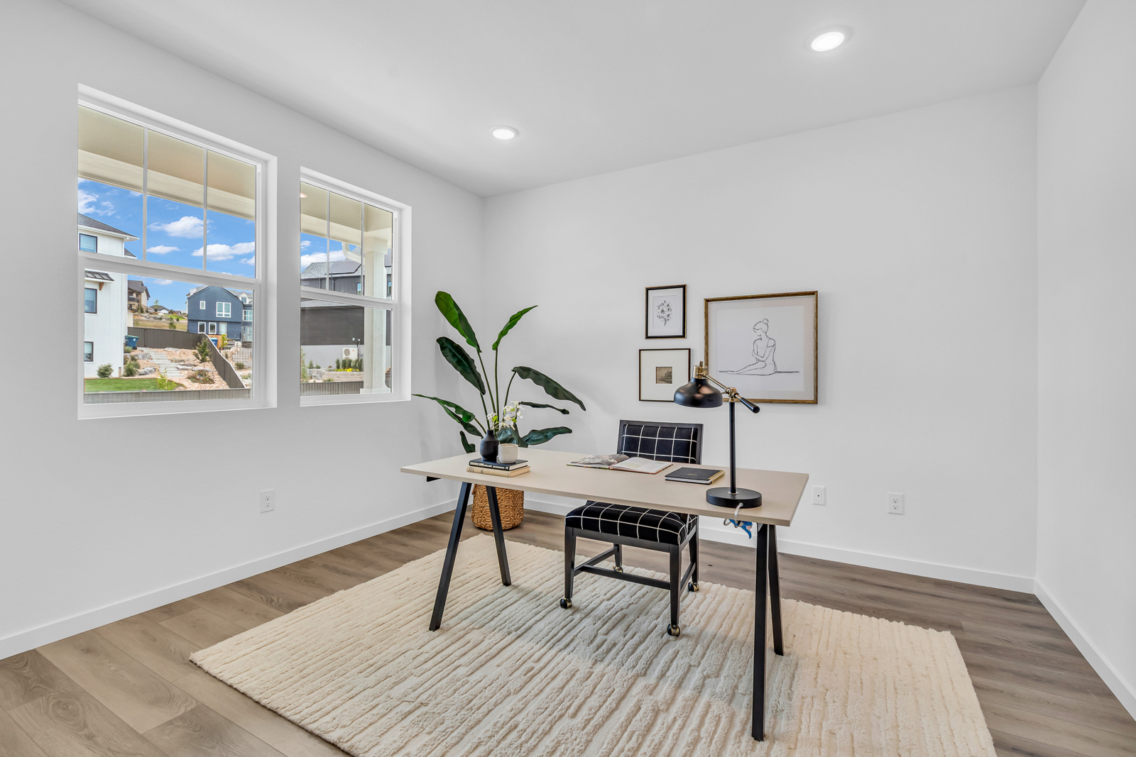 Home office real estate photography with natural light and functional layout in Colorado 