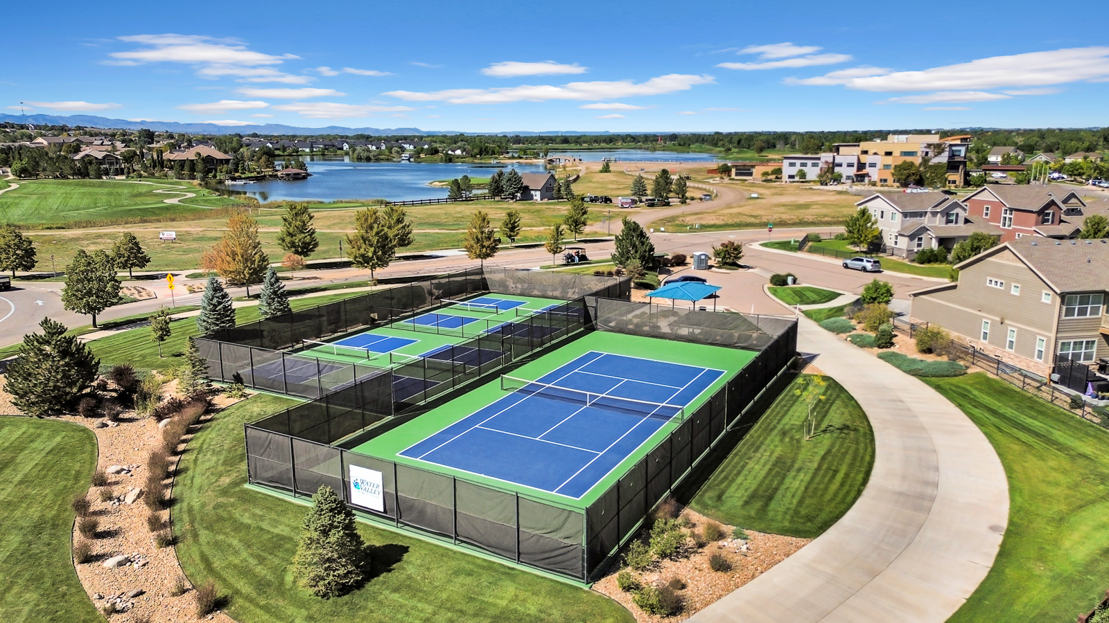 Aerial real estate photography of a residential property and surrounding area in Colorado