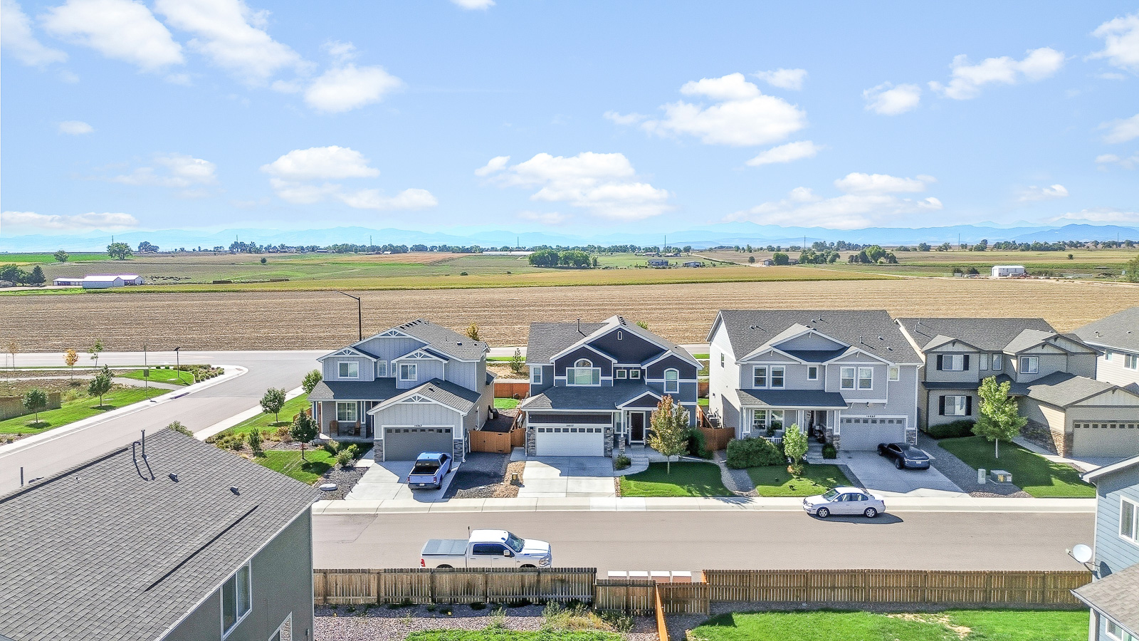 Aerial real estate photography of a residential property and surrounding area in Colorado